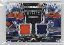 2022-23 Upper Deck Black Diamond Diamond Mine Dual Relics Connor McDavid/Leon Draisaitl #DMDR-MD card