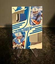 2025 Panini Absolute Team Tandem Materials David Montgomery / Jahmyr Gibbs #TTM-DET card