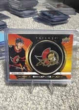 2023-24 Upper Deck Trilogy Rookie Signature Pucks Ridly Greig #RSP-RG card