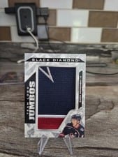 2024-25 Upper Deck Black Diamond Team Logo Jumbo Patch Puzzle - Blue Jackets Zach Werenski #TL-ZW card